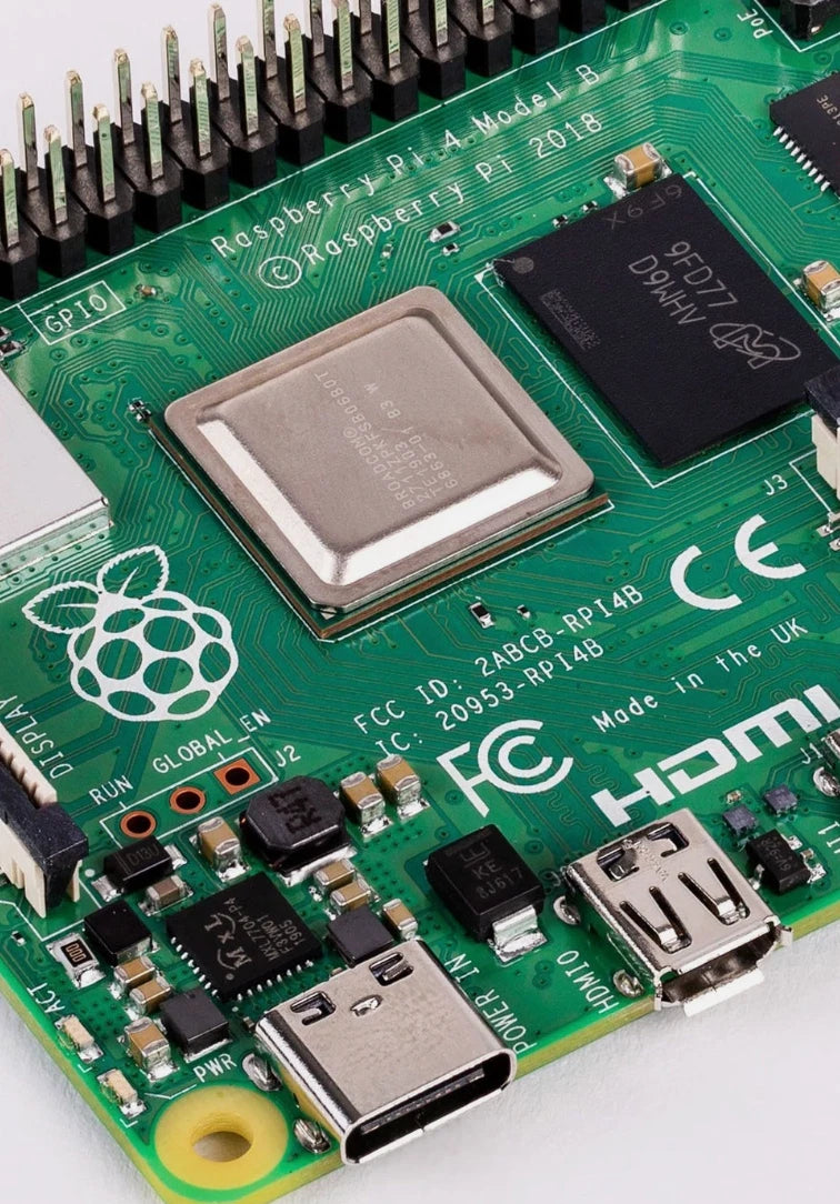 Close-up of a Raspberry Pi computer board with various components.