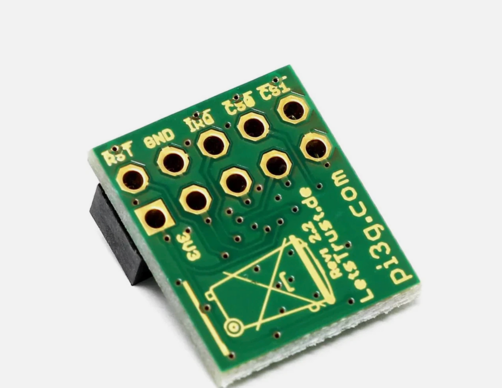 Green electronic component with gold contacts on a white background