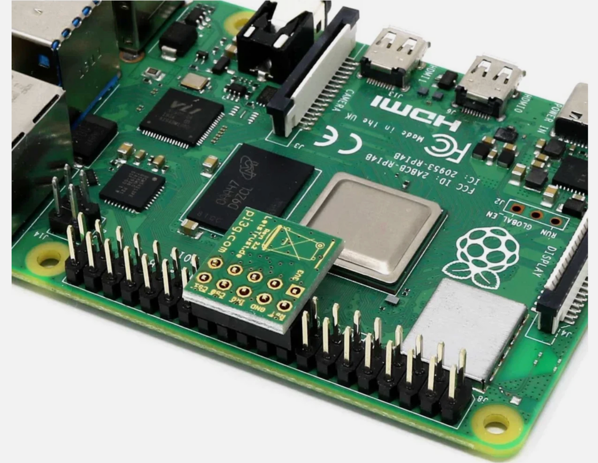 Raspberry Pi computer board with various components on a white background
